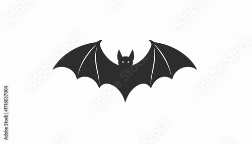 Dark Silhouette of a Bat with Wings Spread Wide, a Common Symbol for Halloween and Spooky Nights