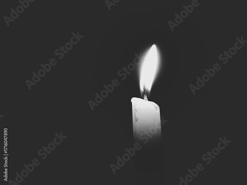 burning candle on darkness black and white image 