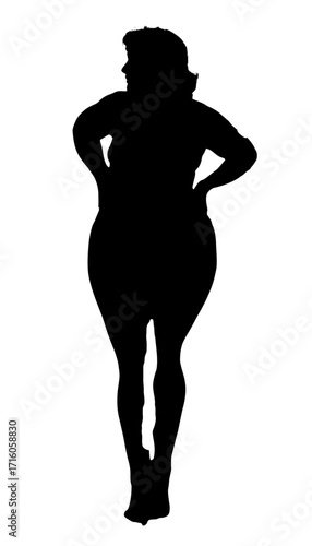 Confident woman with hands on hips projects self-assurance and strength, embodying empowerment and positive body image in a striking silhouette.
