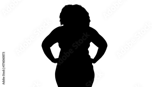 Confident woman with hands on hips projecting strength and determination, embodying female power and leadership in a bold silhouette