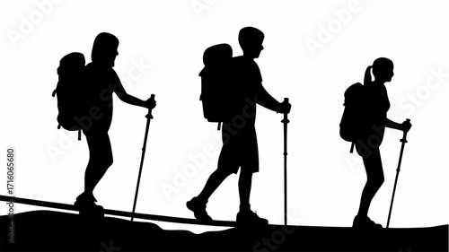 Silhouette of three hikers with backpacks and trekking poles walking on a mountain path in black and white style