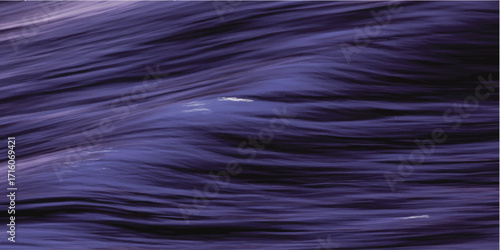 Dark blue ocean surface with rippling waves and abstract light patterns.