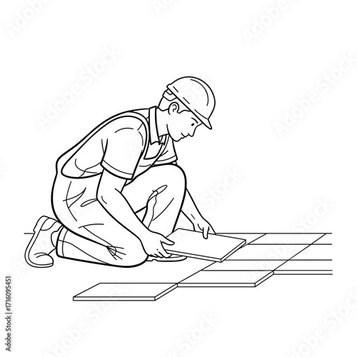 Construction worker laying tiles with focus and concentration on the floor