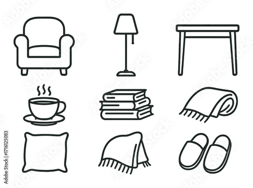 Home comforts: armchair, lamp, table, coffee, books, blanket, pillow, slippers