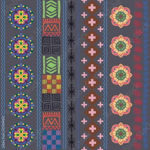 Seamless geometric pattern with colorful mandala and tribal motif creates vibrant decorative background for textile or wallpaper design