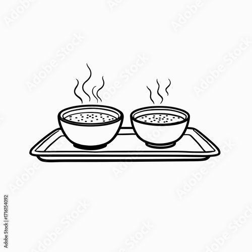 Two steaming bowls on a tray in minimalist black and white design  