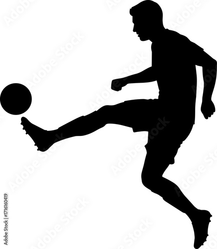 Football player kicking ball mid-air silhouette
