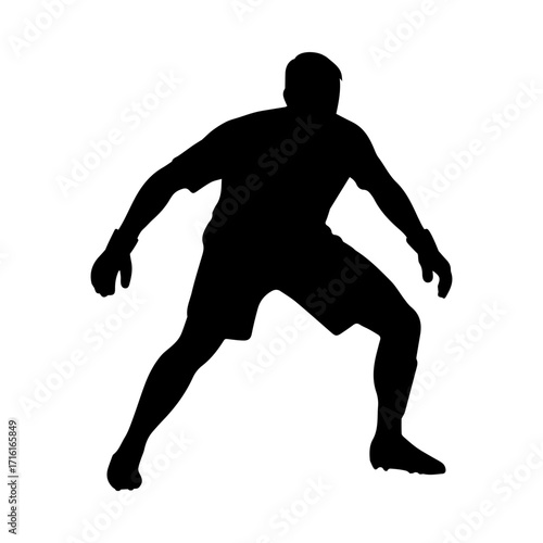 Silhouette of a soccer goalkeeper in defensive stance
