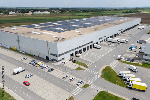 Logistics centers with solar panels on roofs. Aerial view
