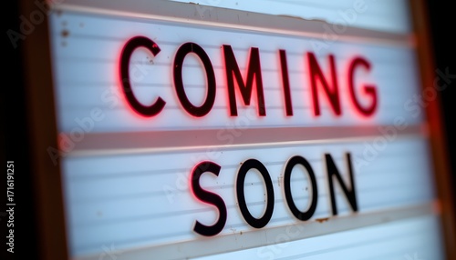 Coming Soon Illuminated Sign: A close-up of a backlit sign displaying the words COMING SOON, creating an anticipation for what's to come. The illuminated letters glow brightly.