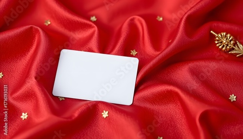 Blank Card on Luxurious Fabric: A pristine white card lies elegantly amidst the sumptuous folds of red fabric, accompanied by golden stars in a photorealistic display.