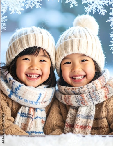 Two children smiling warmly in winter