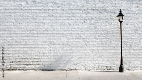 White brick wall with a black lamp post outside