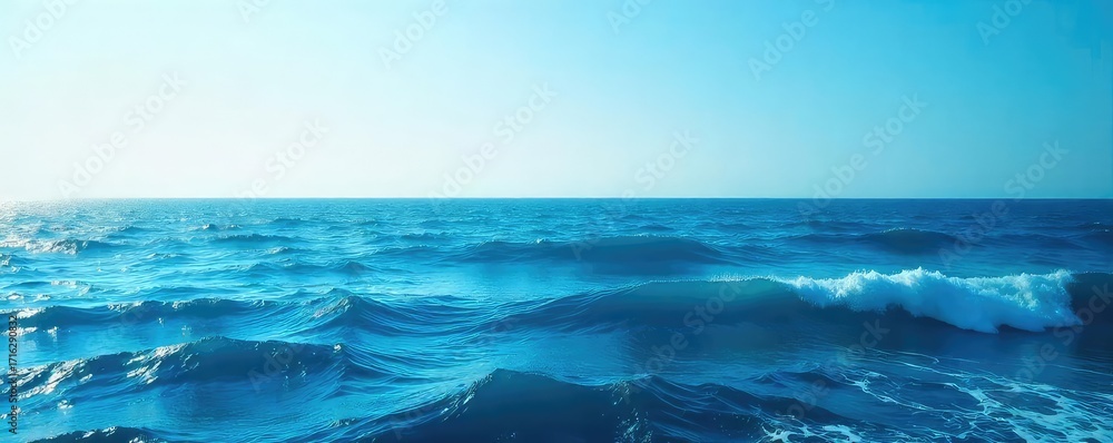 Fototapeta premium Vast expanse of deep blue ocean water, waves gently rolling under a clear sky Perfect for travel, nature, and serenity themes , oceanic, serenity