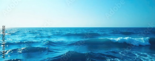 Wallpaper Mural Vast expanse of deep blue ocean water, waves gently rolling under a clear sky  Perfect for travel, nature, and serenity themes ,  oceanic,  serenity Torontodigital.ca