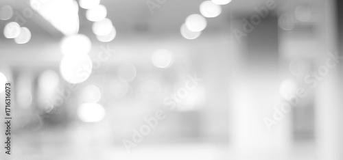 Blur white abstract background, blurred grey gradient bright light with copy space backdrop, banner, blank mordern business office interior hallway building design background, monochrome