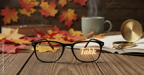 Black-framed eyeglasses on rustic table with 