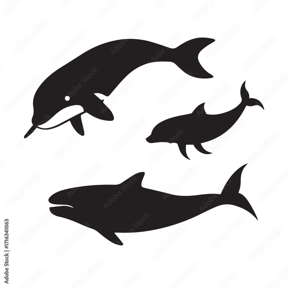 Fototapeta premium Silhouettes of three dolphins swimming in the ocean