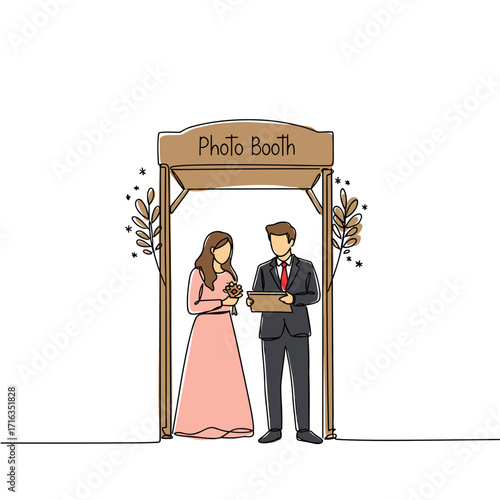 Couple standing inside a photo booth holding props and smiling  