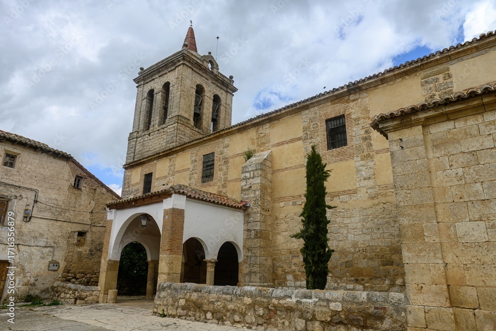 Fototapeta premium Bell tower and portico of Iglesia de la Asuncion in Autilla del Pino, Palencia, Spain