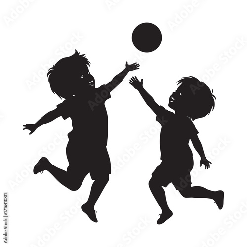 Two silhouetted children joyfully jumping and reaching for a ball in mid air