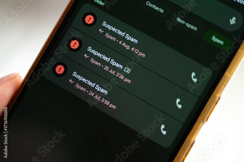 History of Suspected Spam Calls. A mobile phone screen displays a list of past calls, all labeled as 
