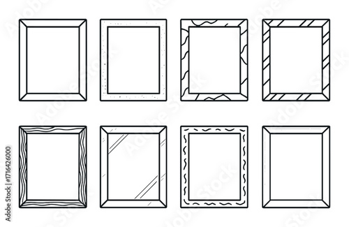 Collection of eight empty picture frames on dark background