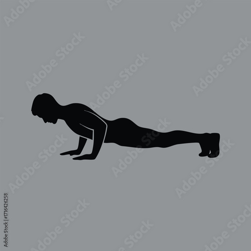Silhouette of a person performing a push-up exercise demonstrating strength and fitness on a plain gray background