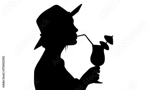 Stylish silhouette of a woman sipping a refreshing cocktail.