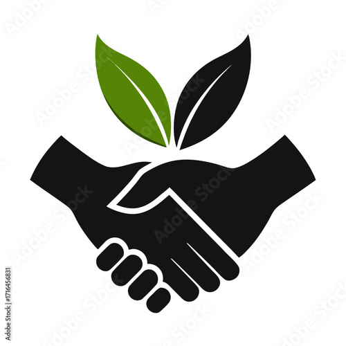 Symbol of partnership and environmental care with shaking hands and green leaves