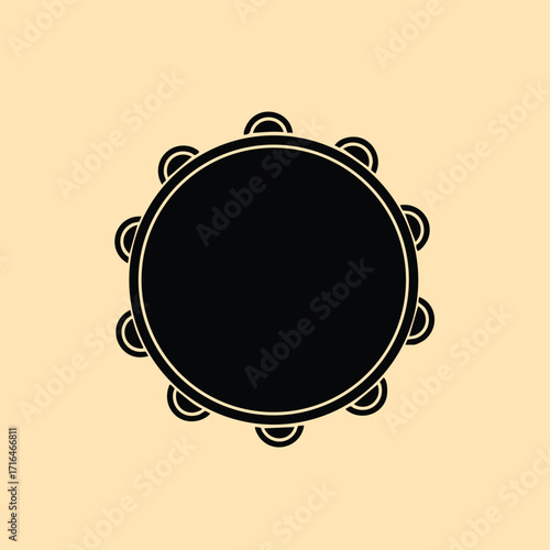 Black silhouette of a tambourine musical instrument with jingles on a beige background in simple flat style