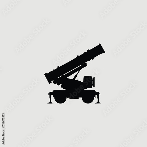 Silhouette of a mobile military rocket launcher vehicle with extended stabilizers on a plain background
