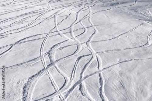 Off-piste ski slope with trace from skis