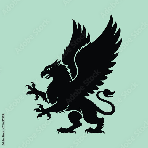 Black silhouette of a mythical griffin with wings spread wide and claws extended on a light green background