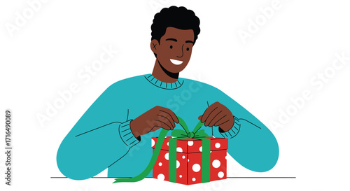 Cheerful man wrapping holiday presents with green ribbon against white space
