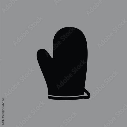 Black silhouette of a single oven mitt isolated on a plain gray background with a simple minimalist design