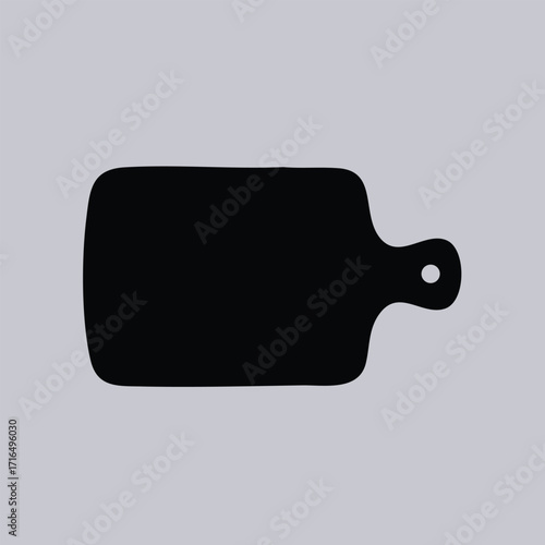 Silhouette of a rectangular cutting board with rounded edges and a handle with a hole for hanging