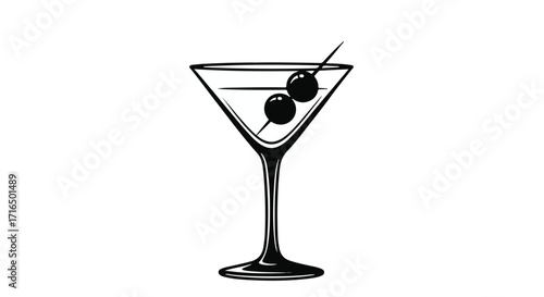 Elegant martini glass with olives on a pick, ready for a sophisticated toast.