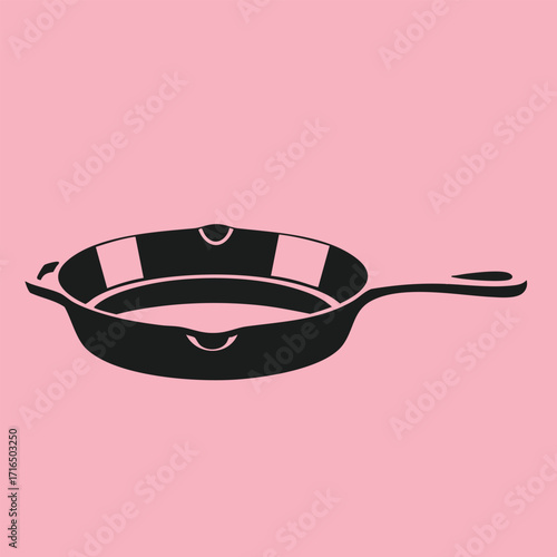 Black silhouette of a frying pan with a long handle isolated on a solid pink background in minimalist style