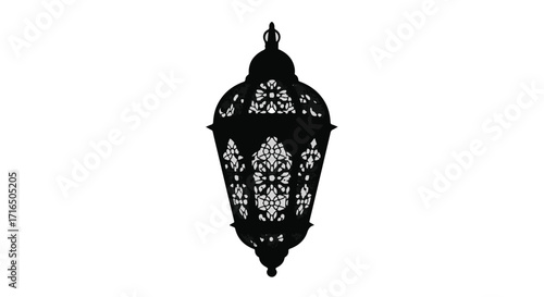 Ornate black lantern with intricate cutouts casting decorative shadows