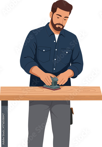 Man sanding wooden plank with sanding block in workshop wearing casual blue shirt and grey pants