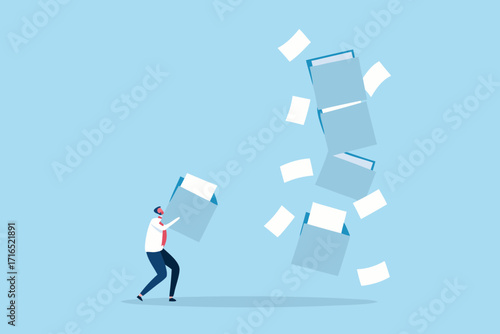 Overwhelmed businessman struggling with a cascade of falling documents and file folders