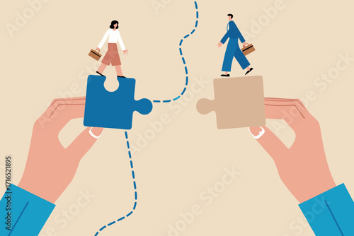 Two business people walking on puzzle pieces held by hands connecting the path forward