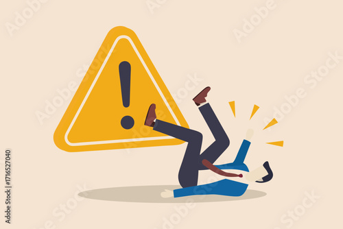 Man in suit falling down next to a yellow caution triangle with exclamation mark warning sign