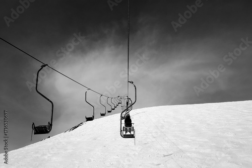 Black and white old chair-lift in ski resort