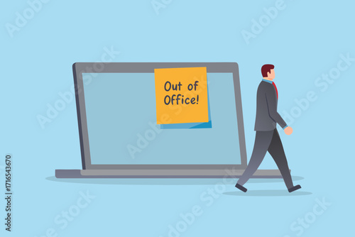 Businessman walking away from laptop with out of office message on screen