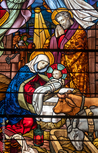 Stained glass (1934) of Christmas Nativity Scene with Virgin Mary and Jesus baby.