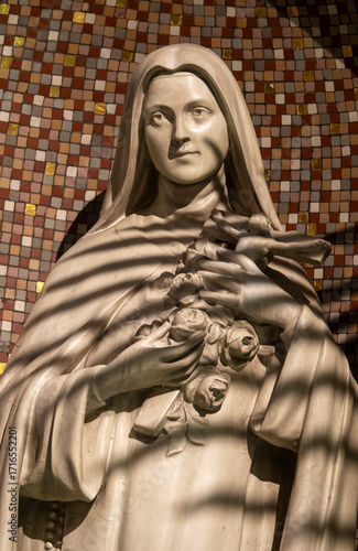 Statue (19th century) of St. Therese of Lisieux, Carmelite nun and Saint of the Roman Catholic Church.
