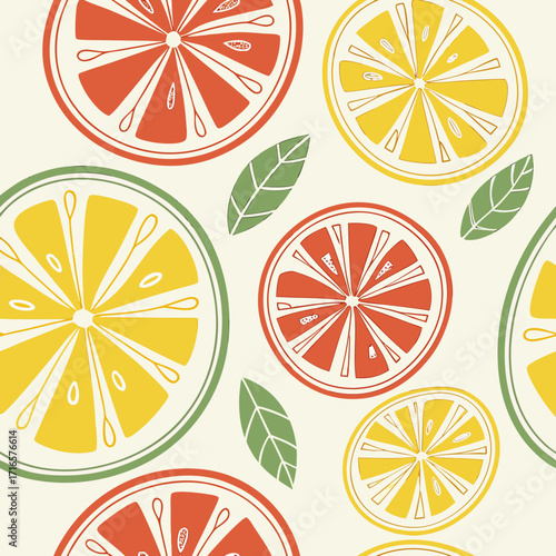 Vibrant citrus fruit slices and green leaves on a light background