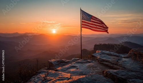 American flag at sunrise over mountains